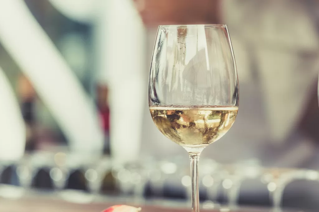 A close up of a glass of white wine
