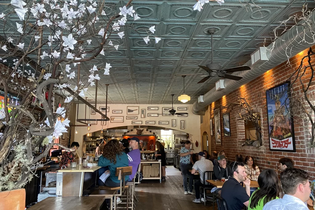 Patrons fill the interior of Diavola Pizzeria in Geyserville, California.