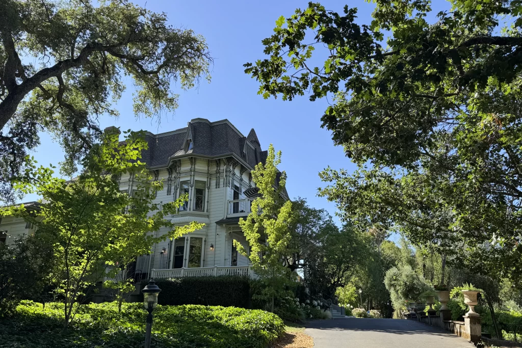 The driveway leading to the Victoria-era Madrona Inn is lined by oak trees in Healdsburg, California