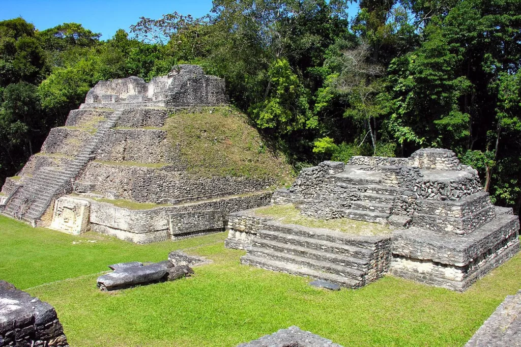 Ancient Mayan stone temples rise above the jungle floor in Caracol, Belize.