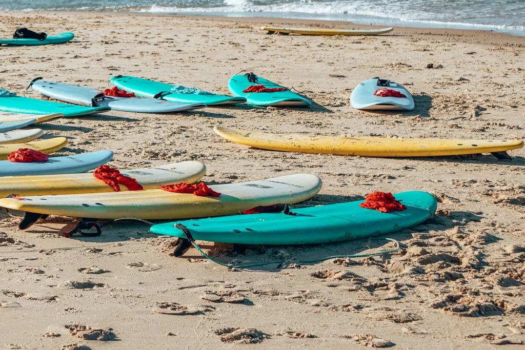 Surfboards line the sand after a lesson.