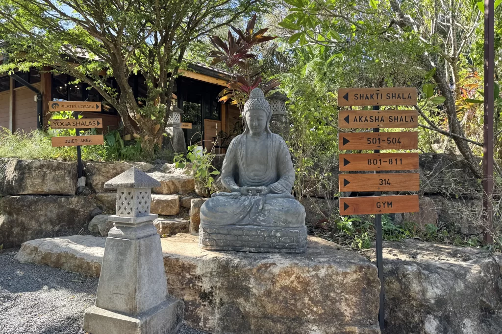 A stone Buddha sits on the lush grounds of the Bodhi Tree yoga resort near Nosara, Costa Rica.