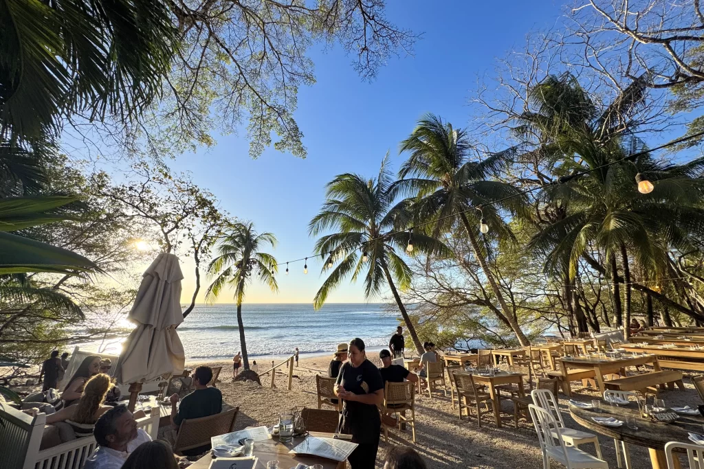 Guests sit at the beachside La Luna restaurant in Playa Pelada, Costa Rica