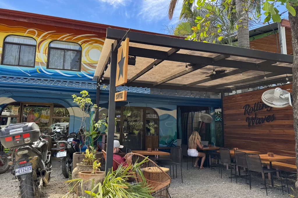 Patrons sit on the outside patio of Rolling Waves Coffee in Guiones, Costa Rica.
