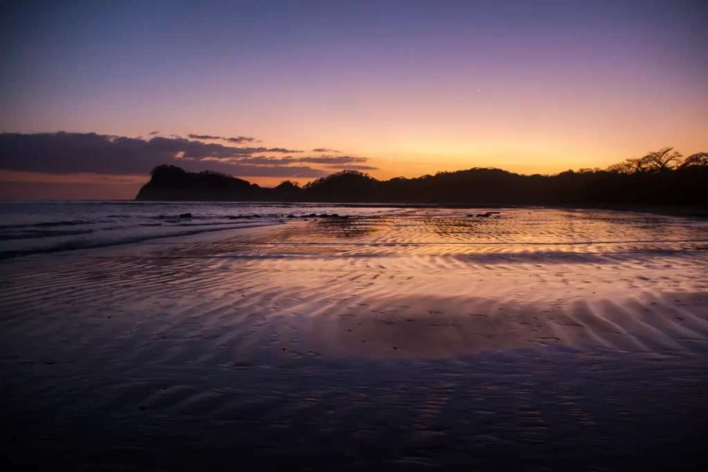 The ridge line of Playa Garza is silhouetted at sunset. Garza is a popular break for those looking for some variety from Guiones surfing.
