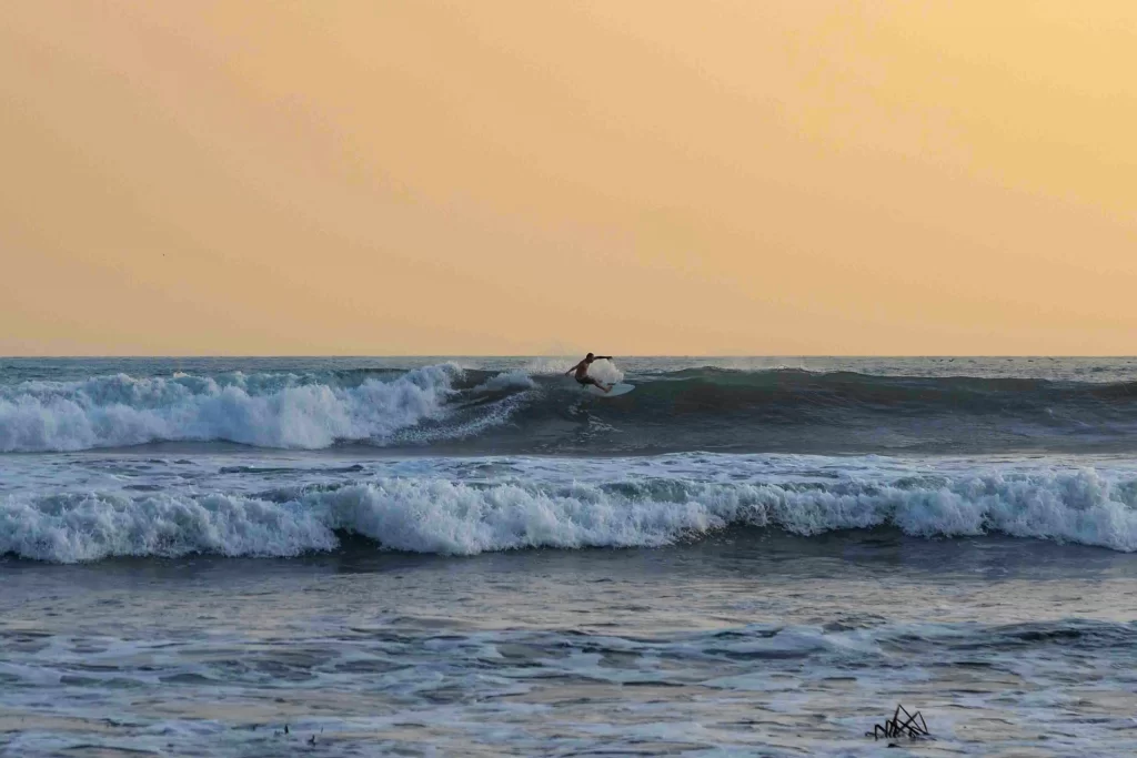 A lone surfer cuts across a wave in Costa Rica.