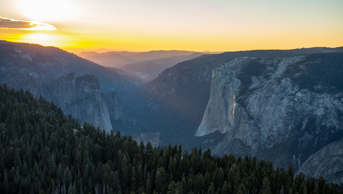 The last rays of sunset shine on Yosemite Valley and El Capitan, as seen from Half Dome.