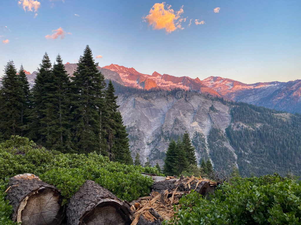 Evening sunset creates alpenglow on distant mountains, as seen from Bearpaw Meadow in Sequoia National Park.