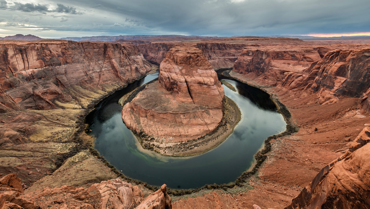 Storm clouds gather above Horseshoe Bend in Page, Arizona.