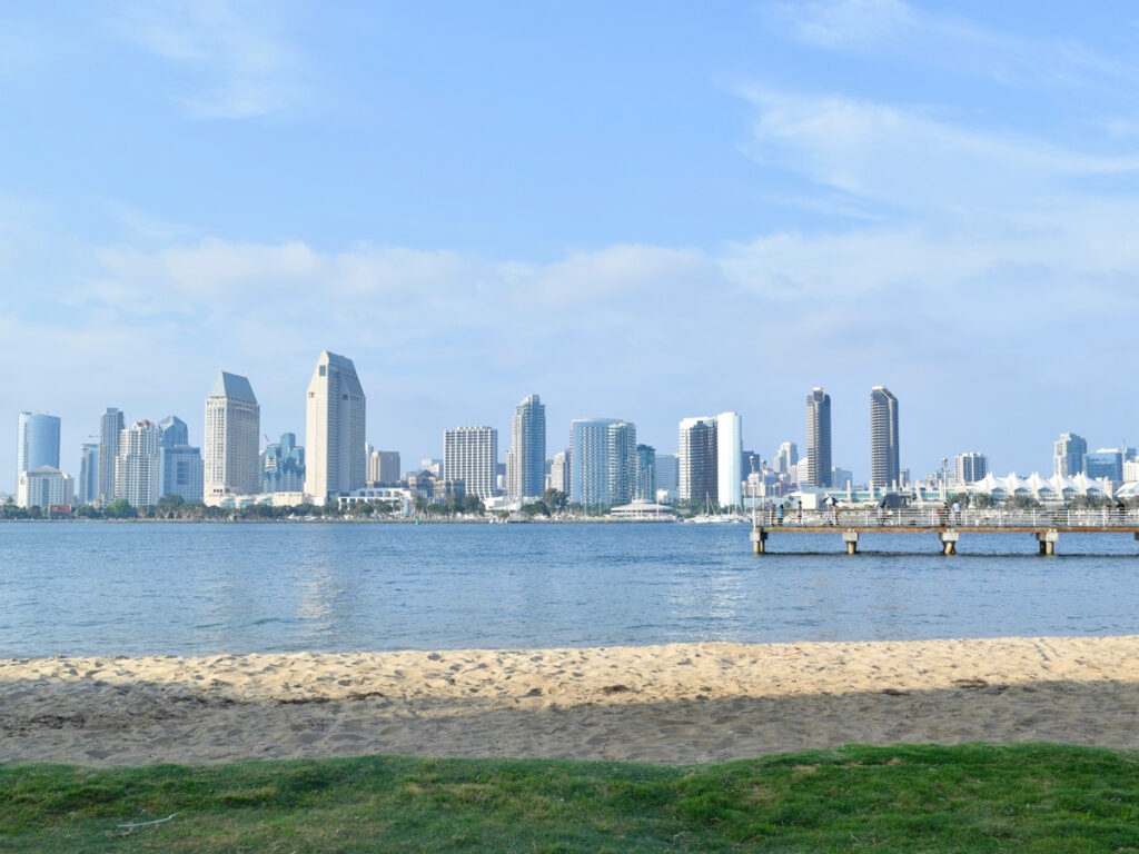 Coronado Ferry Landing, looking out to the downtown skyline, is a popular place to paddle board in San Diego.