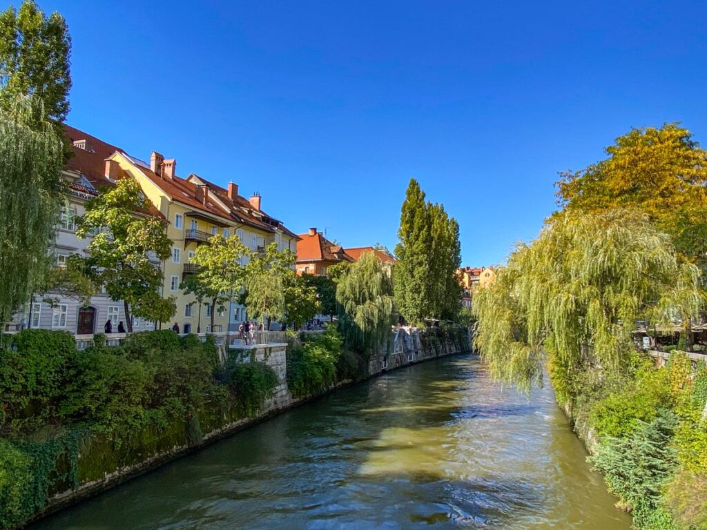 Pastel homes line the Ljubljanica River in Ljubljana, Slovenia.