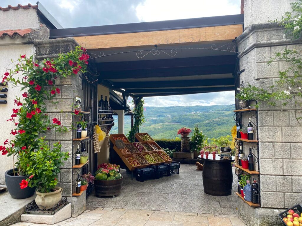 An open air produce and wine store displays its wares in Motovun, Croatia.