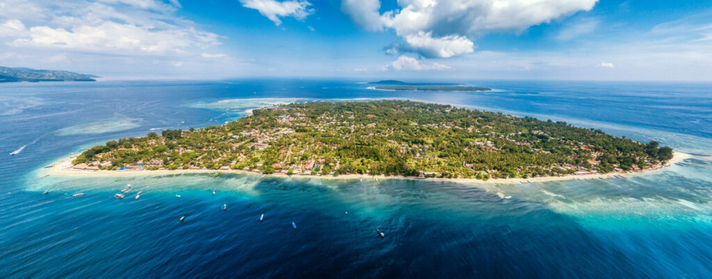 An aerial view of Gili Air in Indonesia's Lombok Strait, with Gili Meno and Gili T in the background.