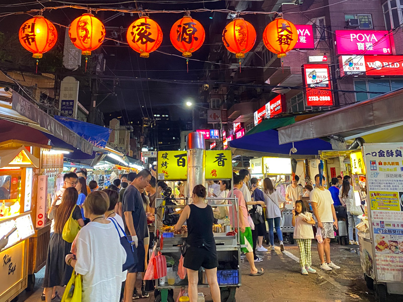 Pedestrians stroll the crowded streets of Linjiang Night Market in Taipei, Taiwan.