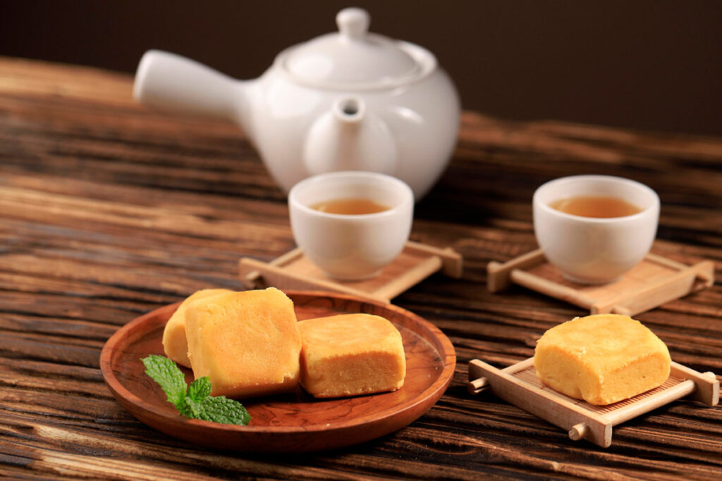 Taiwanese pineapple cake is served with tea.