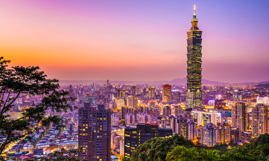 The Taipei skyline, with Taipei 101 prominent in the foreground, is seen from Elephant Mountain at sunset.