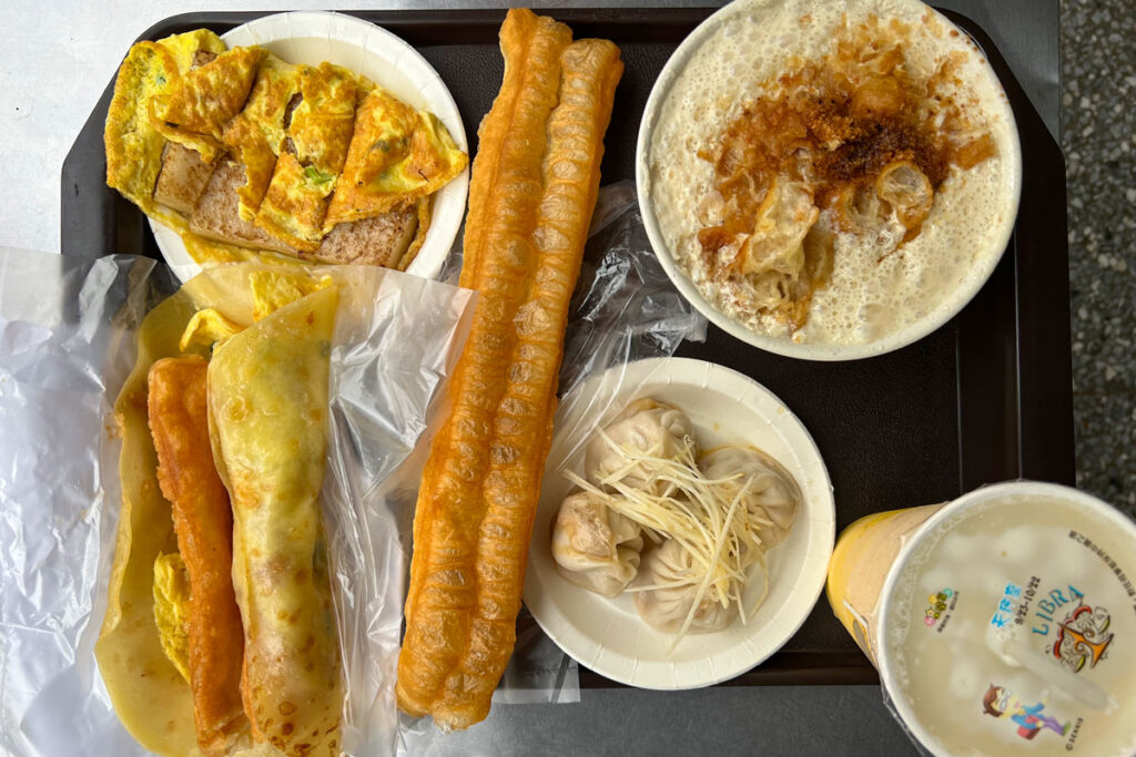 A tray is laid out with traditional Taiwanese breakfast foods at Yong He Soy Milk King in Taipei, Taiwan.