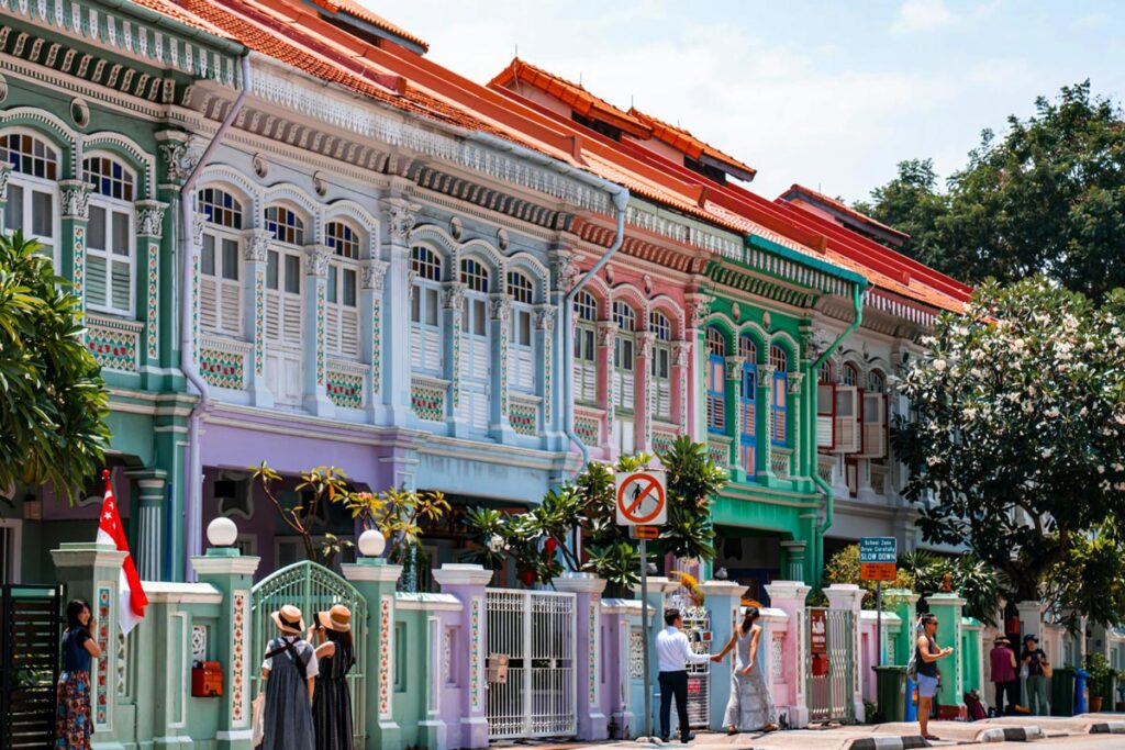 Tourists stop to take photos in front of the famous pastel-colored Peranakan houses, in Singapore's Katong-Joo Chiat neighborhood