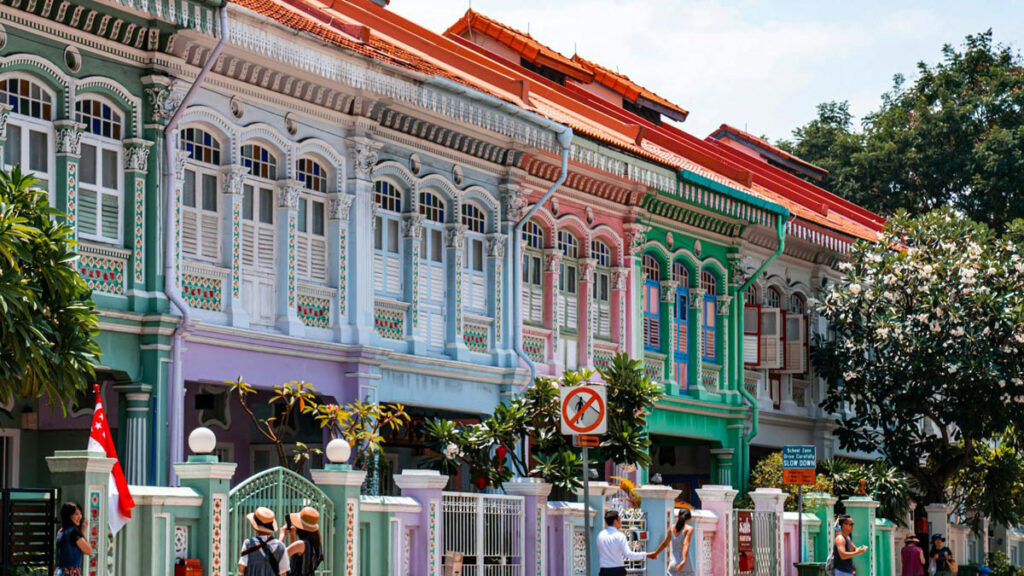 Tourists stop to take photos in front of the famous pastel-colored Peranakan houses, in Singapore's Katong-Joo Chiat neighborhood