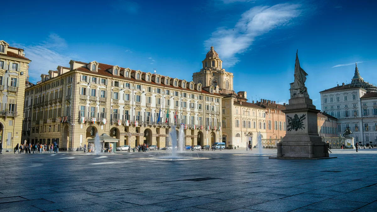 Ornate buildings line the Piazza Castello in Turin, Italy.