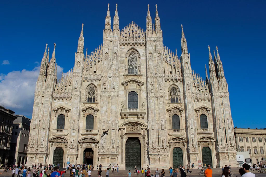 Tourists mingle on the steps of the Duomo in Milan. When deciding where to go in northern Italy, Milan is one of the most popular cities for history and culture.