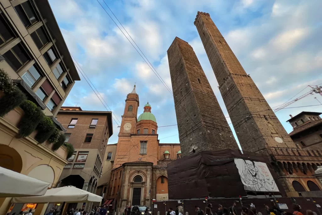 The medieval "Due Torre", or two towers, rise above the street in Bologna, Italy.