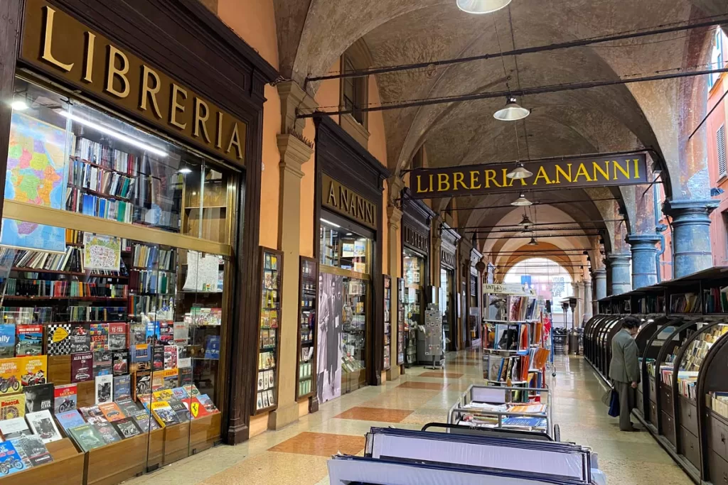 A man peruses the open-air shelves of Libreria Nanni, the oldest bookstore in Bologna, Italy.