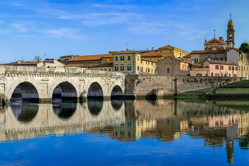 The Tiberius Bridge, dating to ancient Rome, spans the Marecchia River in Rimini, Italy.