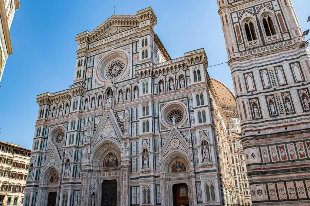 The intricate, pastel-colored facade of Santa Maria del Fiore in Florence, Italy
