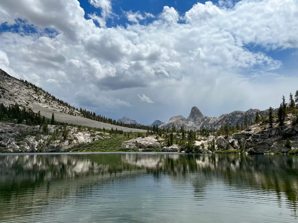 The granite Fin Dome peak rises behind the shores of Dollar Lake in the high Sierra of Kings Canyon National Park