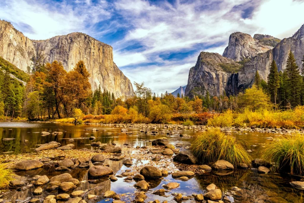 Valley View, an iconic viewpoint in Yosemite National Park, is resplendent in autumn color. Fall is one of the best times to visit Yosemite for nature photography.