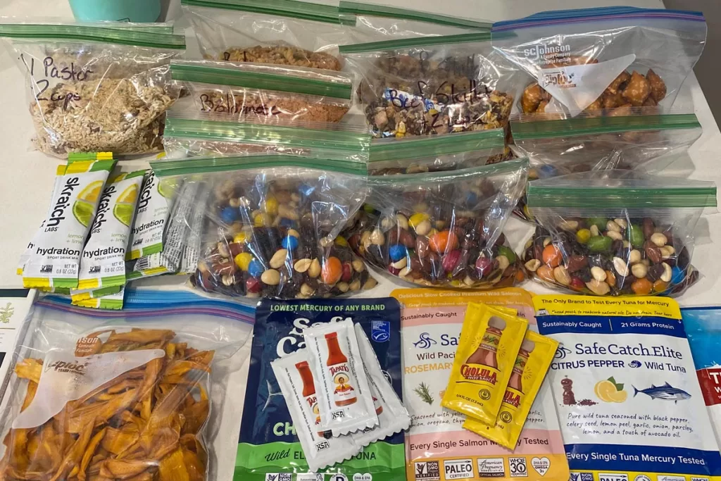 A close-up of pre-portioned meals and snacks intended for a backpacking trip.