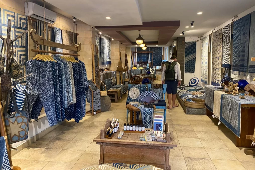 A shopper peruses traditional Indonesian blue and white textiles at Itak Batik in Ubud, Bali.