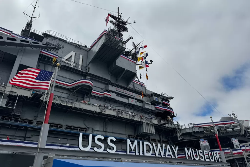 A flag waves outside the USS Midway Museum. This is one of the best places to go in San Diego California for military history.