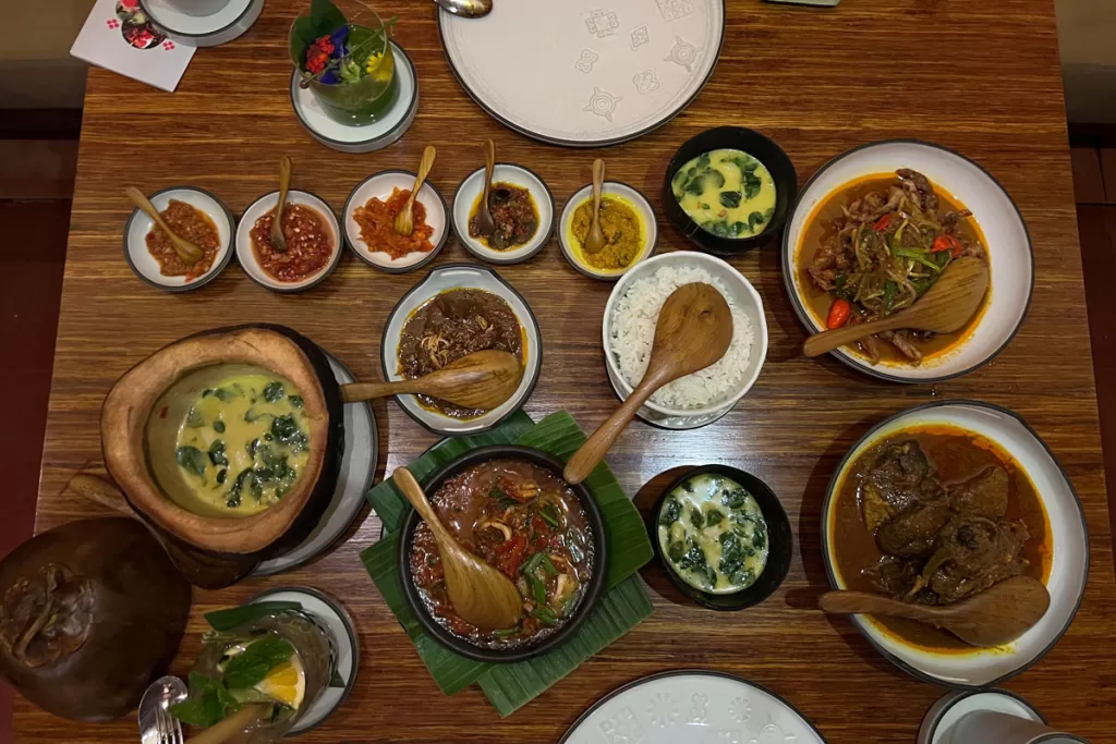 Numerous bowls of traditional Indonesian cuisine are laid on a table at Nusantara restaurant in Ubud, Bali.