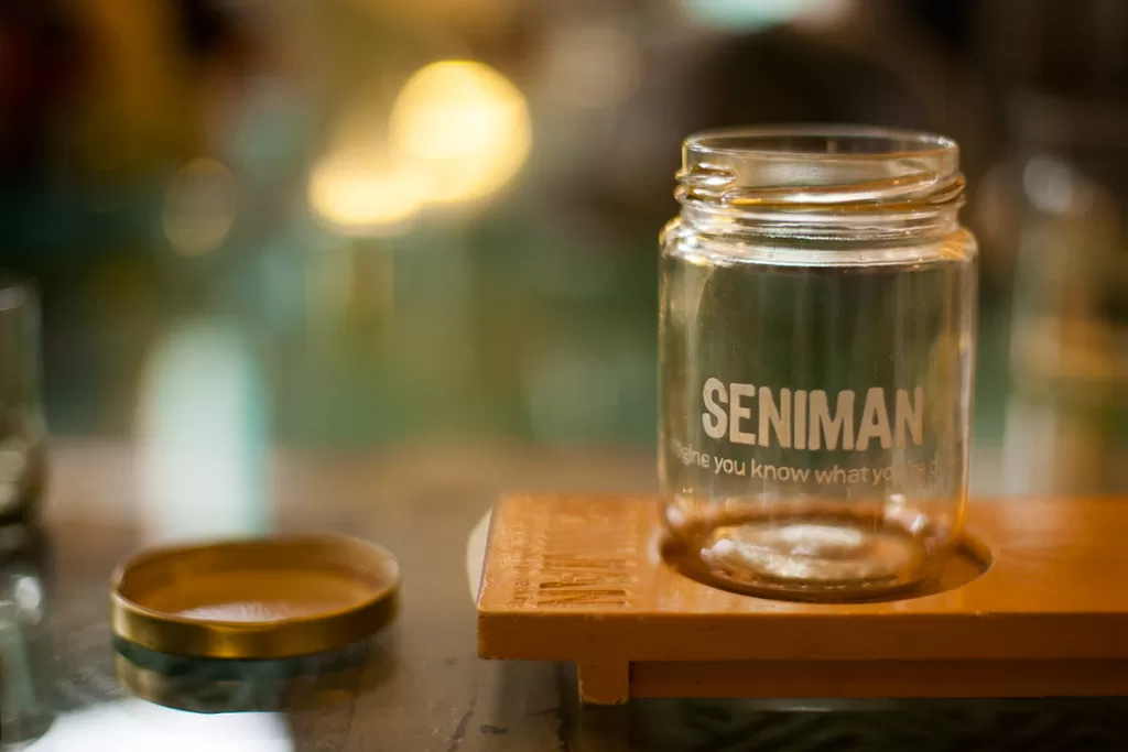 A coffee glass sits on a tray at Seniman Coffee Studio in Ubud, Bali.