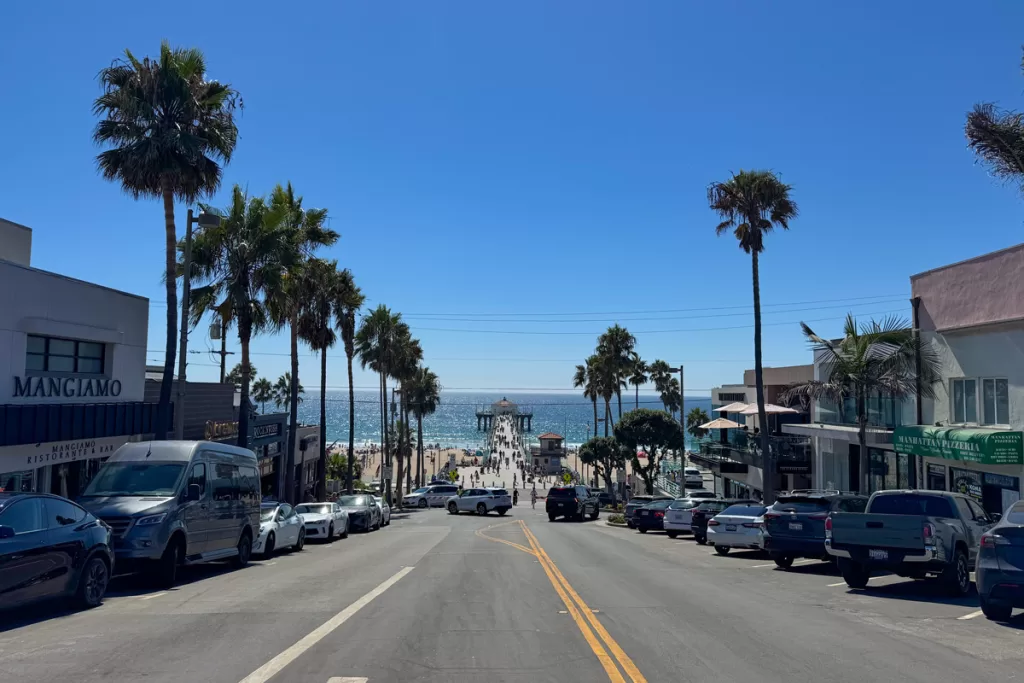Cars line downtown Manhattan Beach, California, looking out to the Manhattan Beach Pier.